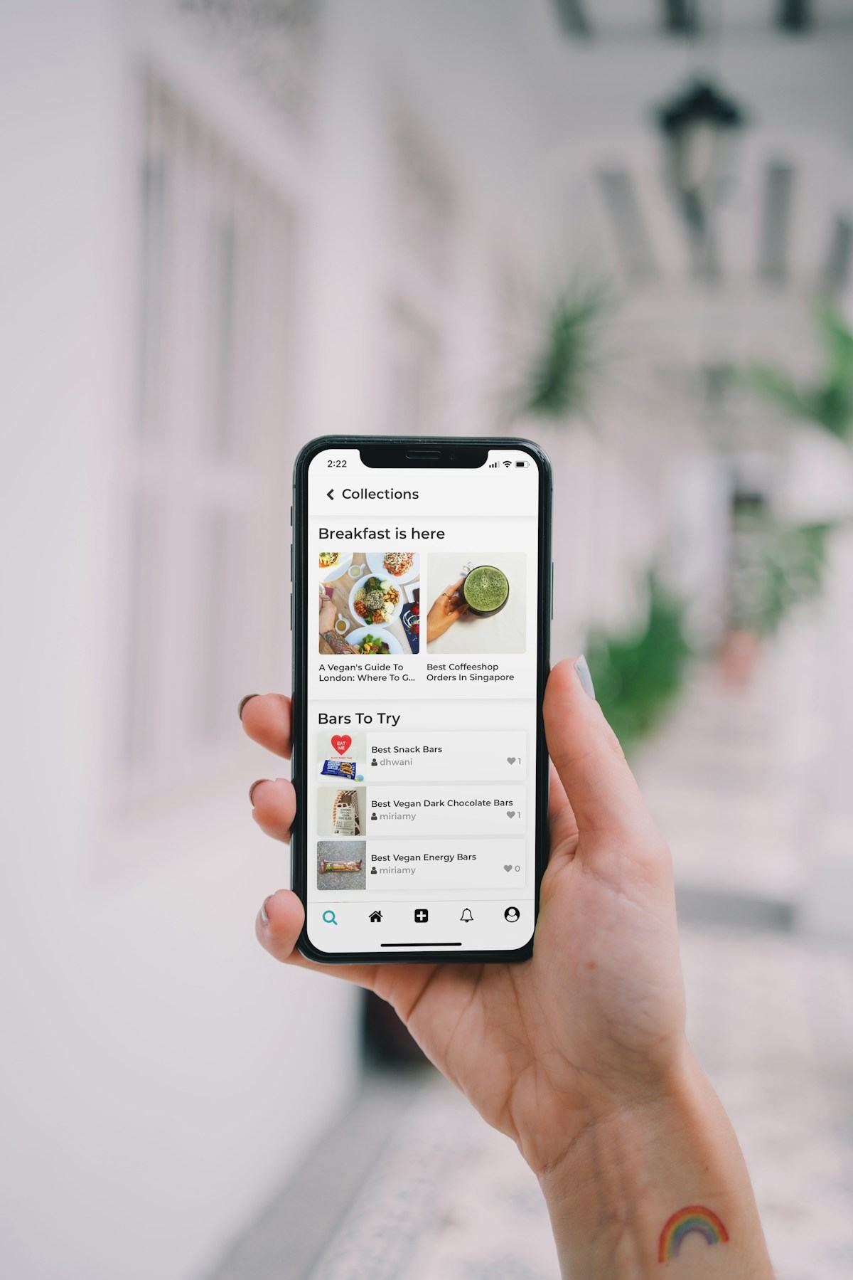 A smartphone displaying a content collections feed with article cards
